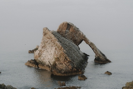 Majestic rock formation in sea Portknockie