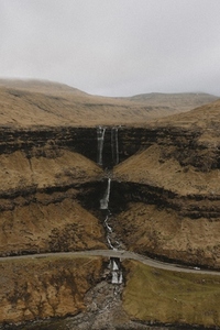 Three tier waterfall over cliff Fossa Haldarsvik Faroe Islands
