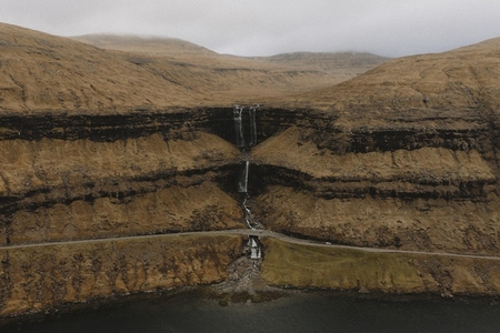 Three tier waterfall over cliff Fossa Haldarsvik Faroe Islands 02