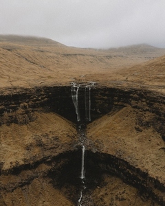 Three tier waterfall over cliff Fossa Haldarsvik Faroe Islands 03