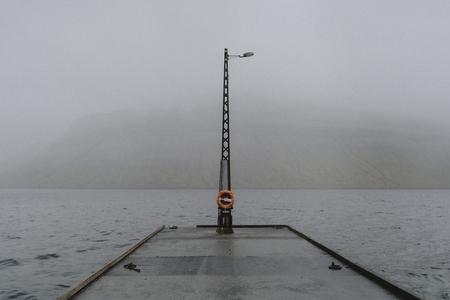 Wet jetty over foggy ocean