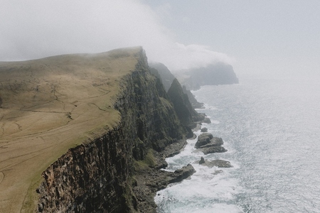 Majestic rugged cliffs over ocean
