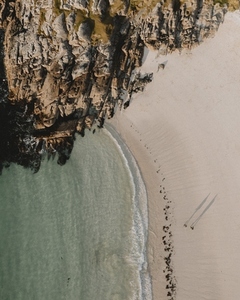 Aerial view from above people on sandy ocean beach