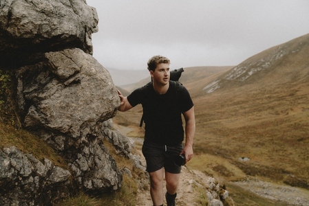 Man hiking in rugged mountains
