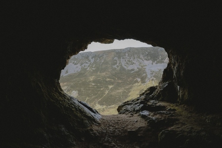Rugged cave with mountain view