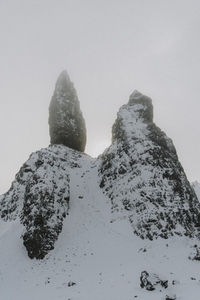 Snow covered mountain rock formation Old Man of Storr