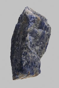 Close up blue Bolivian sodalite stone on gray background
