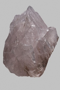 Close up pink Madagascan rose quartz on gray background