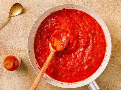 Homemade tomato sauce on a spoon