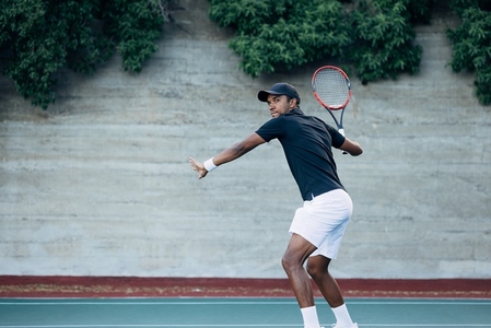 Male tennis player preparing to receive the serve