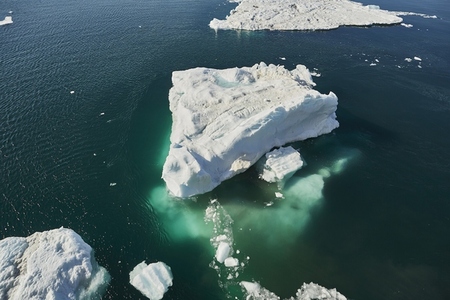 Melting iceberg on sunny ocean surface Antarctic Peninsula Weddell Sea Antarctica
