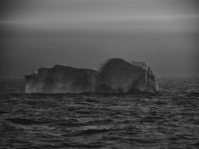 Mysterious gray iceberg on ocean surface off Antarctic Peninsula Weddell Sea Antarctica
