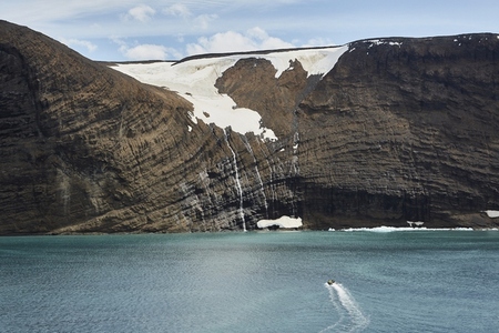 Glacier melting off cliff into ocean Antarctic Peninsula Weddell Sea Antarctica