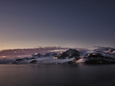 Scenic view snowy majestic mountain at dusk Antarctic Peninsula Weddell Sea Antarctica