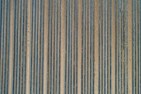 Aerial view polyethylene tunnels in rows in agricultural field Darmstadt Germany