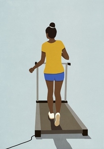 Woman exercising walking on treadmill