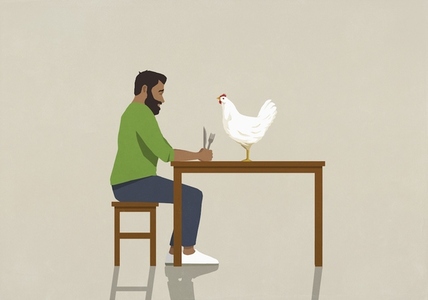 Man with fork and knife staring at chicken on dining table