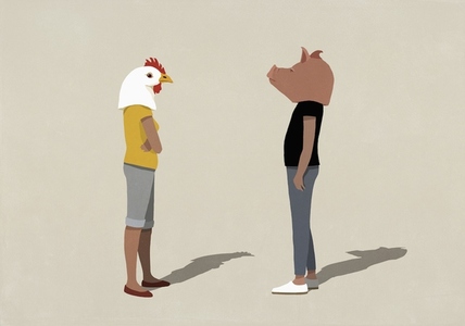 Confrontational couple in pig and chicken heads standing face to face
