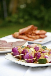 Close up of barbeque platter of food on garden table