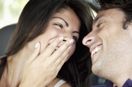 Close up of young couple laughing