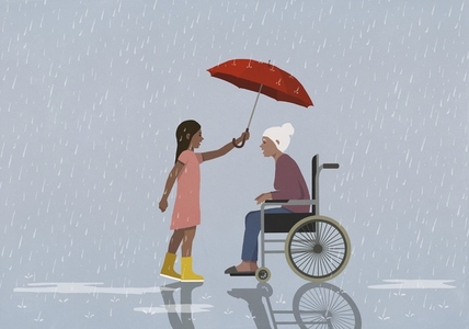 Caring girl holding umbrella over senior woman in wheelchair protecting her from rain