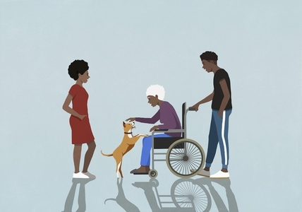 Adult children watching senior mother in wheelchair playing with dog