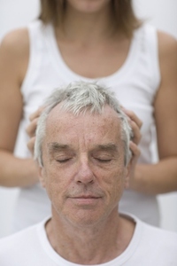 Close up of gray haired man receiving head massage
