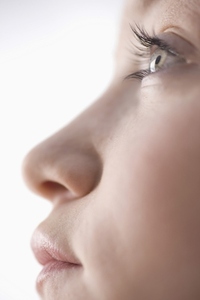 Extreme close up of young woman mouth nose and eye