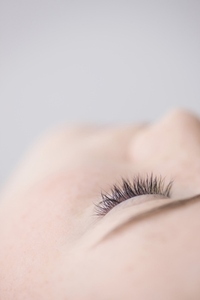 Extreme close up of young woman closed eye