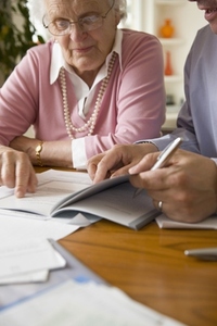 Portrait of a businessman and woman sitting and looking at documents