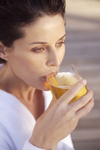 Woman drinking apple juice