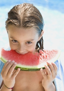 Young girl eating water melon