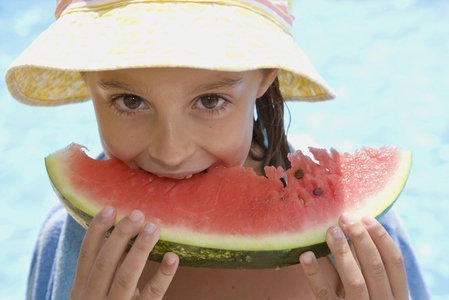 Young girl eating water melon
