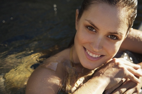 Woman  in a swimming pool smiling