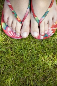Close up woman feet wearing flip flops
