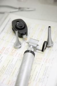 Otoscope laying on table