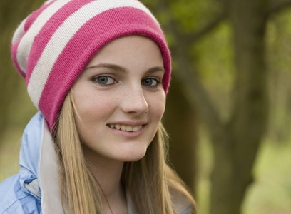 Close up of teenaged girl wearing woolly hat
