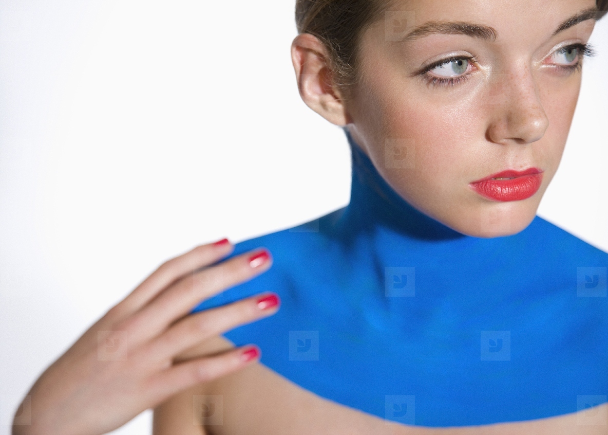 Beautiful young woman with decollete painted with electric blue body paint  stock photo (279338) - YouWorkForThem