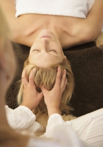 Woman receiving a scalp massage