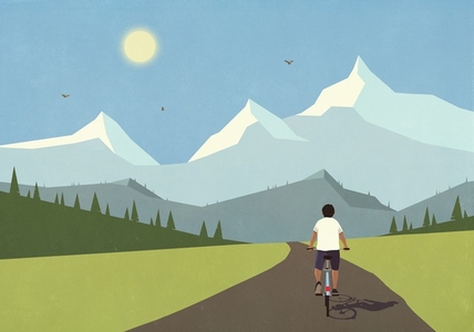 Man cycling on remote valley road below sunny idyllic summer mountain range