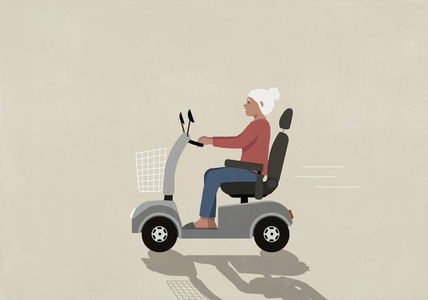 Senior woman speeding on the move in motorized wheelchair