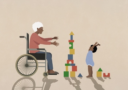 Senior grandmother in wheelchair watching happy baby boy playing with toy blocks