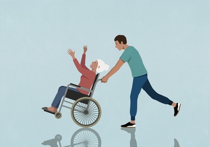 Son pushing happy playful senior mother in wheelchair