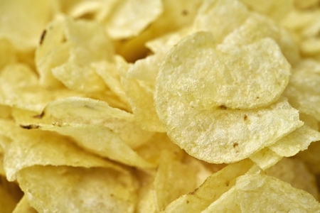 Extreme close up yellow potato chips