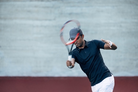 Tennis player during an intense workout outdoors