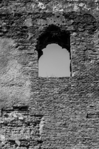Window on a ancient stone wall