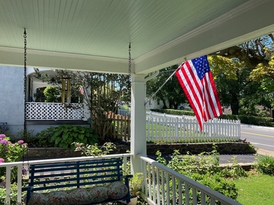 Front porch with American flag
