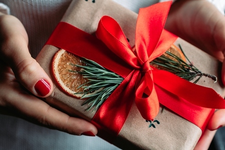 Hands holding Christmas gift box