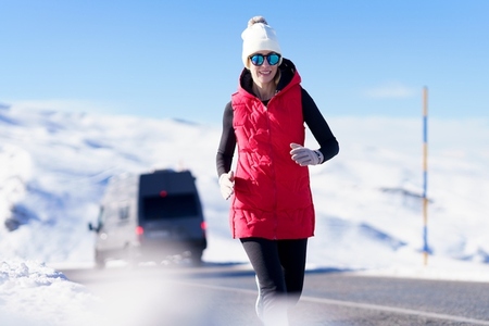Healthy woman jogging in winter nature