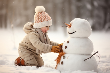 A boy building a snowman